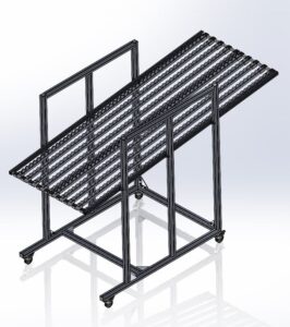 A 3D model of a metal storage rack with a slanted design and multiple horizontal bars. The rack stands on wheels, suggesting mobility and industrial use. FlexMation Long Angled Flow Rack